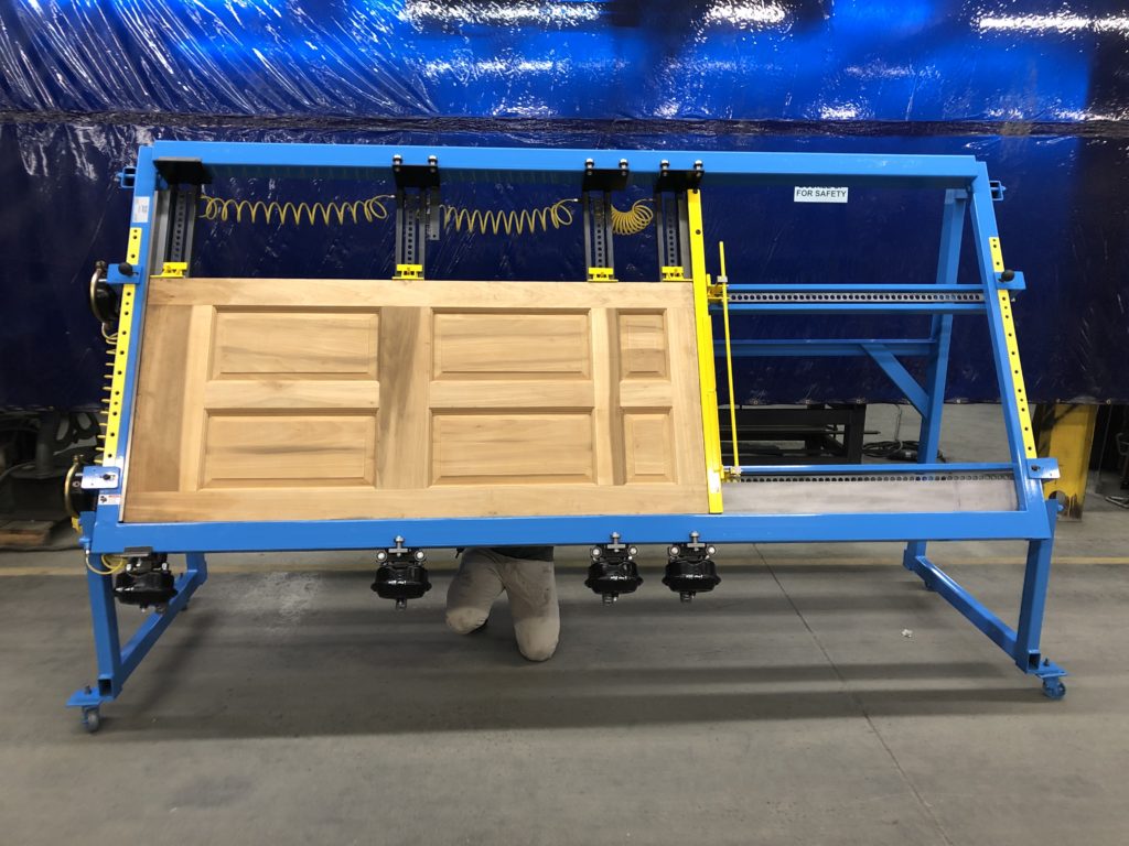 Removable vertical center rail for multiple cabinet door squaring.